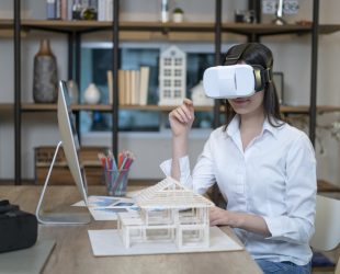 Young architect examining home design