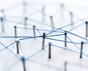 A large grid of pins connected with string. Communication, technology, network concept