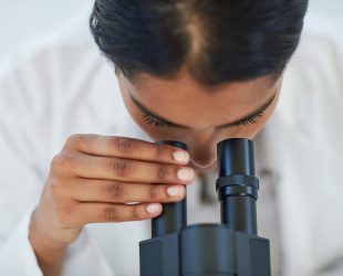 Cropped shot of a young female scientist working in a lab