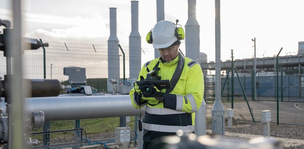 Quantitative optical gas imaging: an engineer uses a FLIR camera to check for gas leaks at a pipeline site