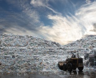 wheel loader working load bottle plastic recycle from the mountain of plastic bottle